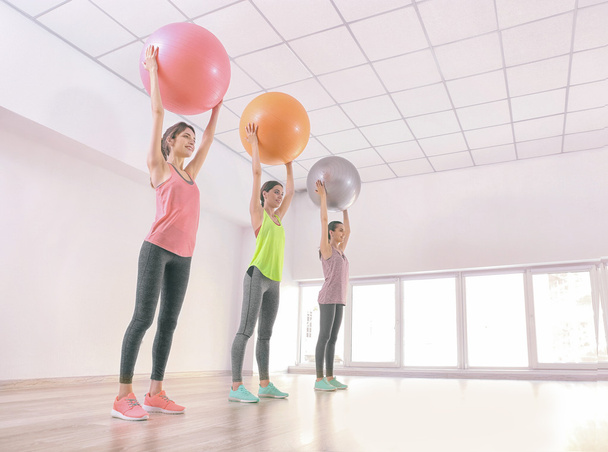 Women doing exercise with balls - Fotografie, Obrázek