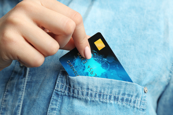 hand putting credit card  - Фото, зображення