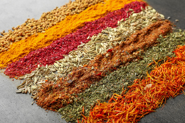 Different spices on gray  - Фото, зображення