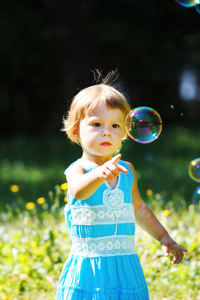 Little girl with bubbles - Фото, изображение