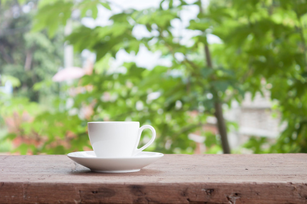 Mini white coffee cup on tabletop - Fotoğraf, Görsel