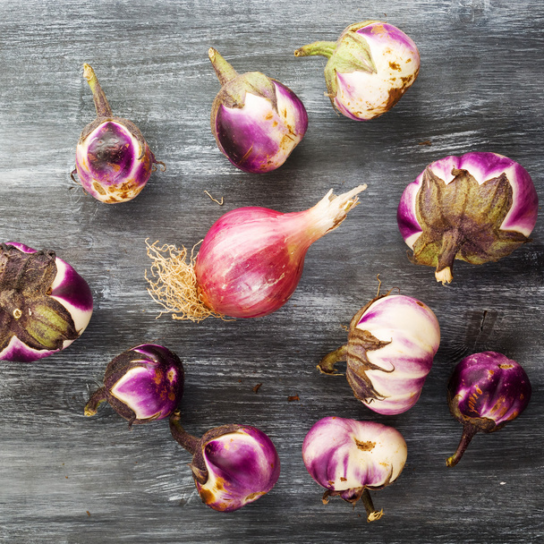 still life with eggplants and onion grown in organic farming  - Фото, изображение