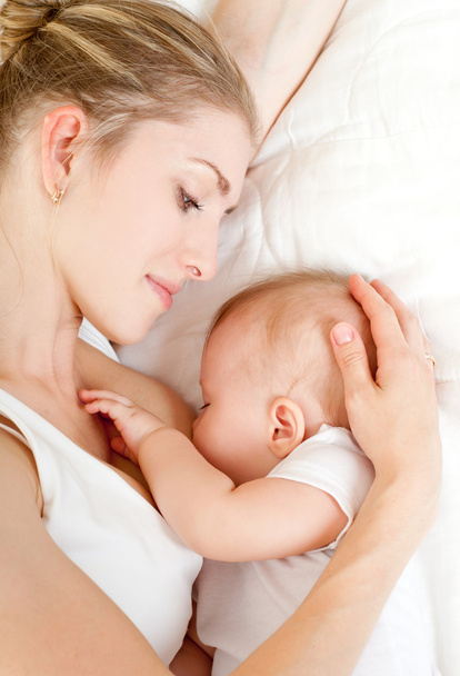 Mother breast feeding - Фото, зображення