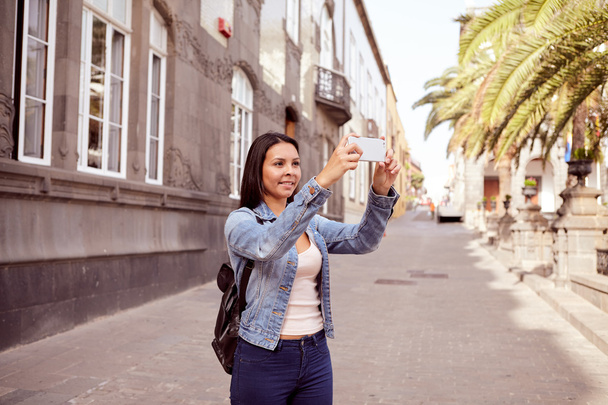 woman tourist with cellphone in city - Photo, image