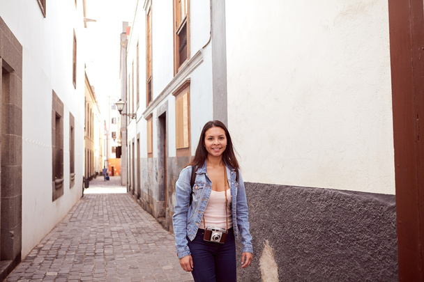 Pretty young lady walking with backpack - Photo, image