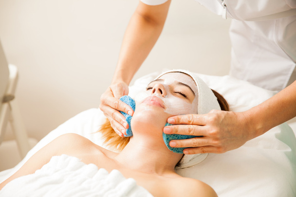  therapist massaging a woman's face - Фото, изображение