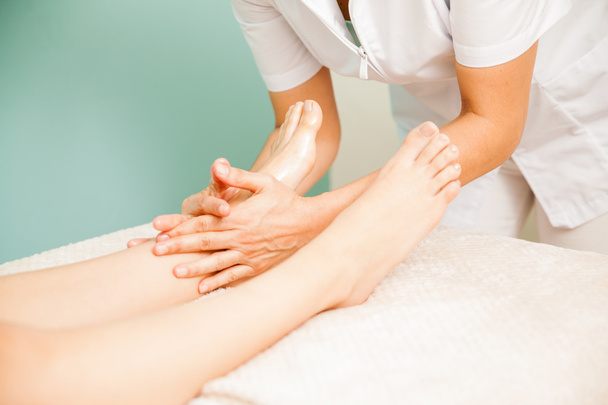 therapist in the middle of a reflexology session - Photo, image