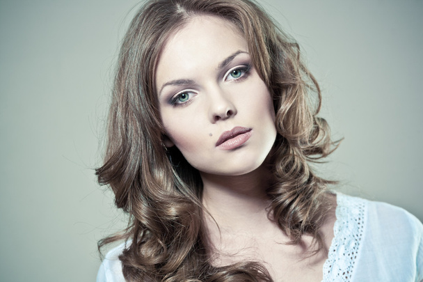 Closeup portrait of a sexy young woman with natural makeup and perfect skin - Fotó, kép