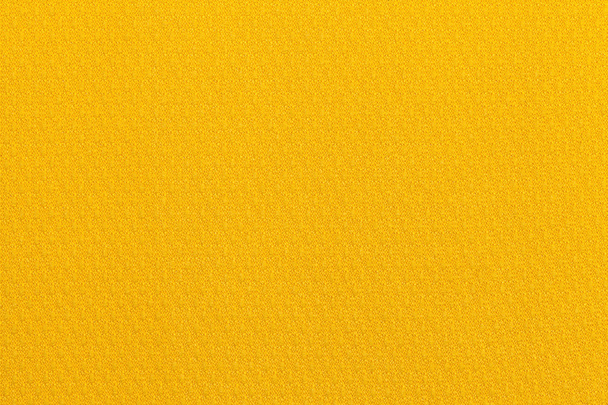 Jasnym tle ugier żółty z materiału włókienniczego. Tkaniny naturalne tekstury. Tło. - Zdjęcie, obraz