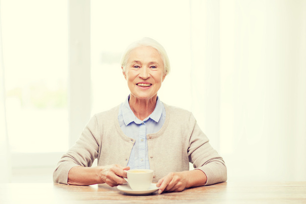 happy senior woman with cup of coffee - Photo, Image