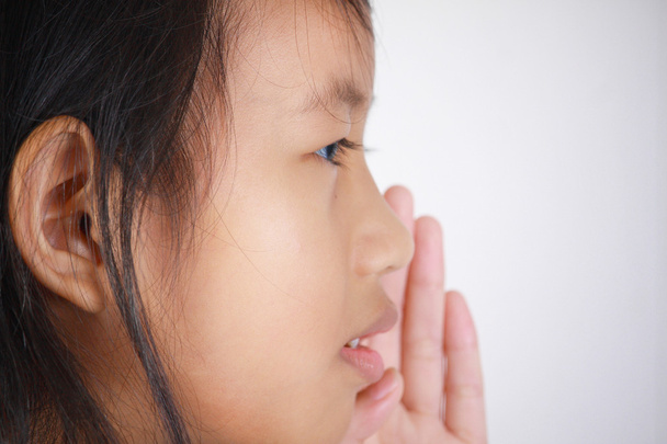 Little girl with whispering gesture - Photo, Image