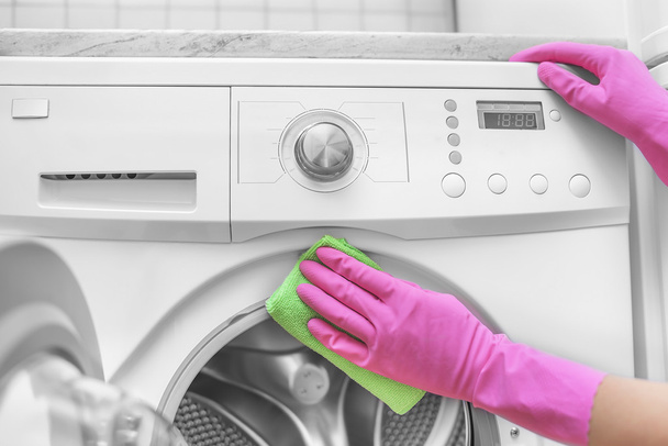 Female hand wash washing machine. - Photo, image