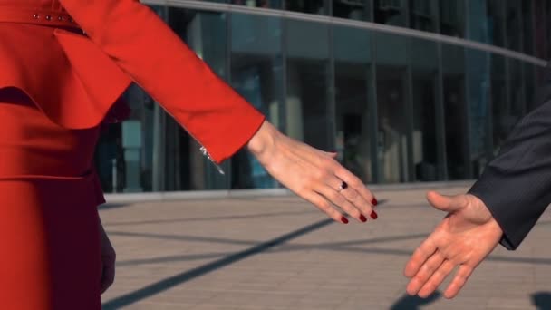 Business partners men and women doing a handshake - Footage, Video