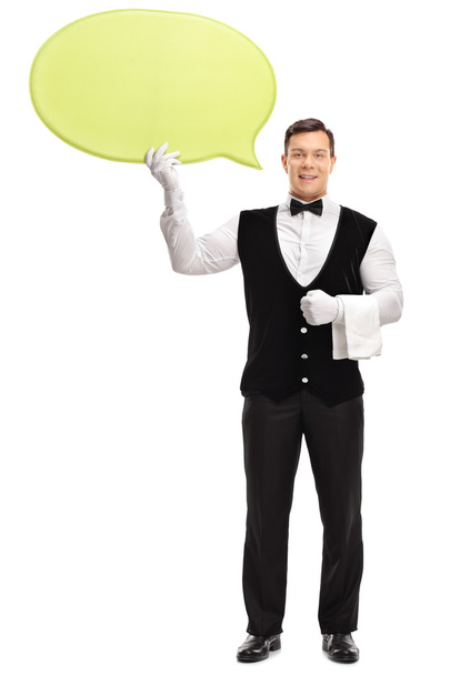 Male waiter holding a speech bubble  - Foto, Imagem