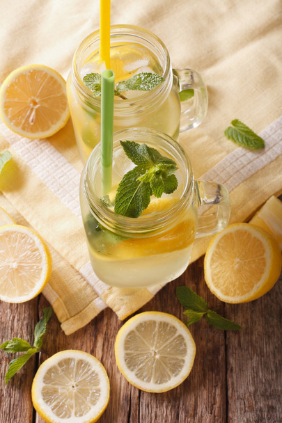 Traditional lemonade with ice and mint close up in a glass jar.  - Foto, Bild