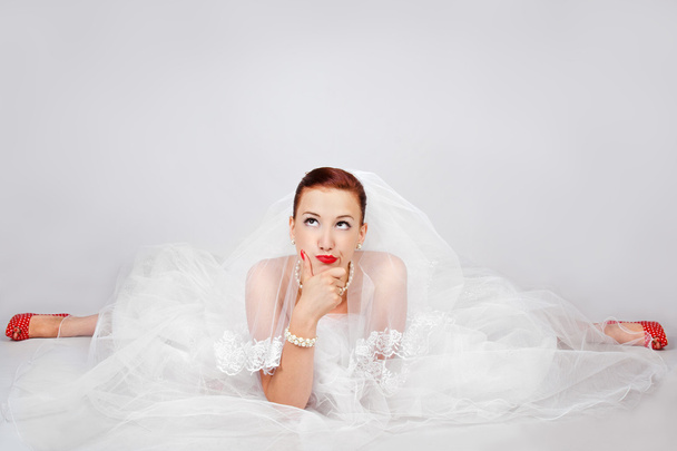 Portrait of beautiful bride in red shoes - 写真・画像