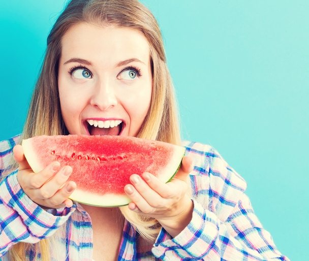 Happy young woman holding watermelon - Foto, Imagen