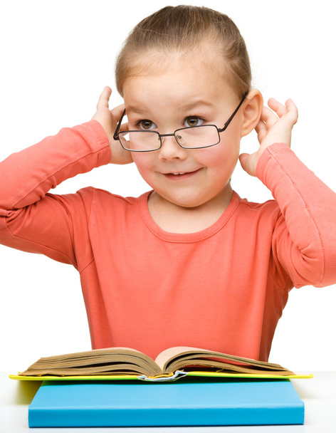 Cute cheerful little girl reading book - Foto, Bild