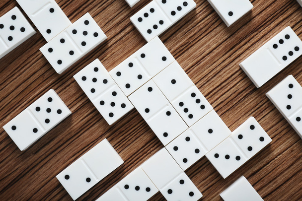 Heap of dominoes on table - 写真・画像