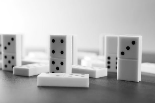 Heap of dominoes on grey  - 写真・画像