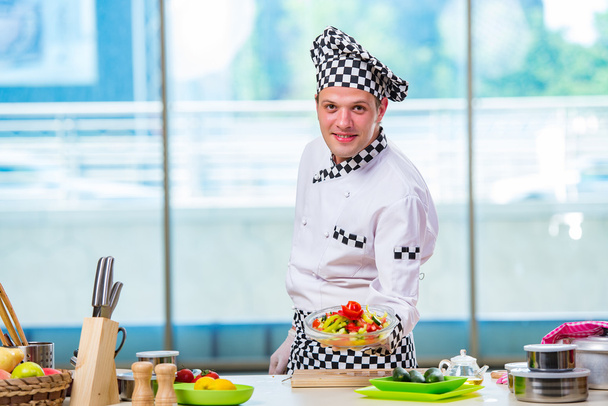 Male cook preparing food in the kitchen - Fotografie, Obrázek