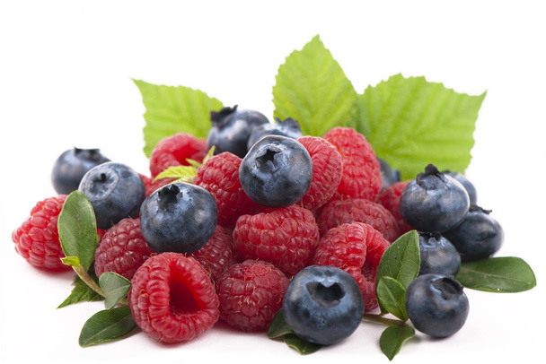 Raspberries and blueberries on white background - Photo, image