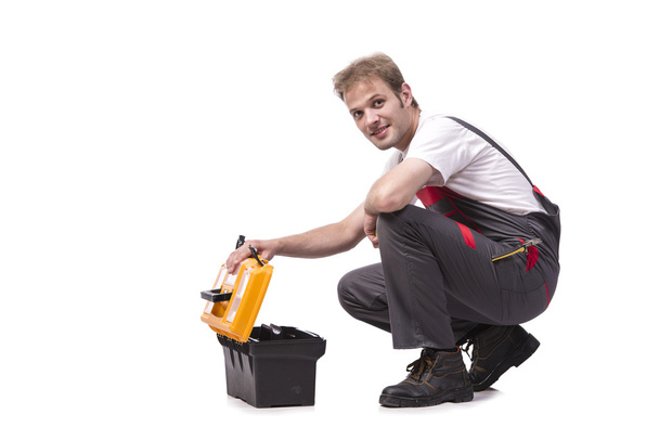 Young man with toolkit toolbox isolated on white - 写真・画像