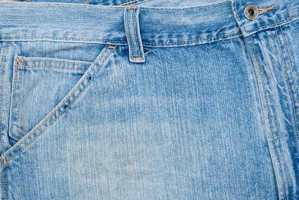 Close up image of blue denim jeans background or texture. - Foto, afbeelding