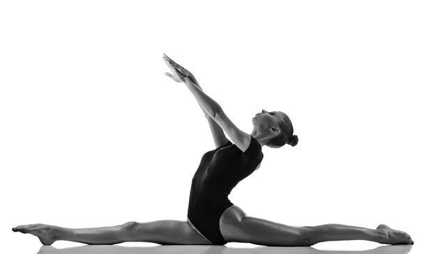 Gymnastic girl over white background - Valokuva, kuva