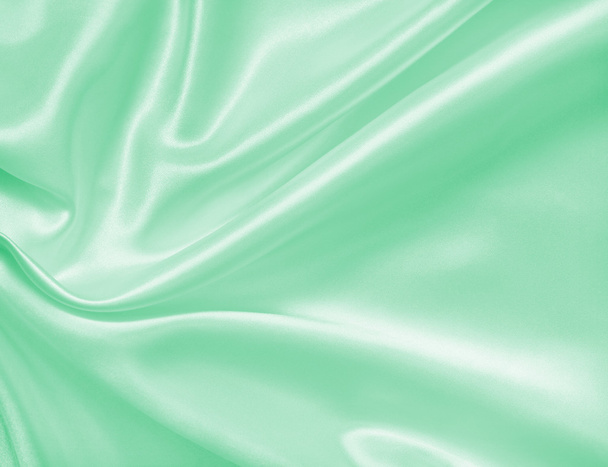 Smooth elegant green silk or satin texture as background  - Fotografie, Obrázek