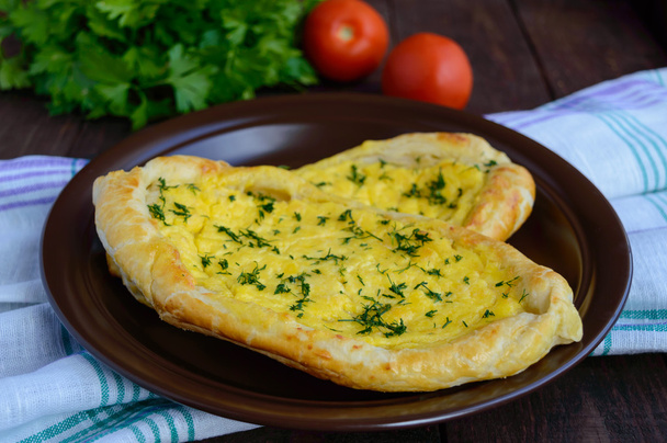 Khachapuri in Adjara (flat cakes with different fillings in the form of a boat) - the national dish of Georgian cuisine. - Photo, Image
