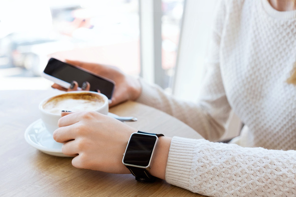 Cup of coffee, watch and mobile phone - Foto, imagen