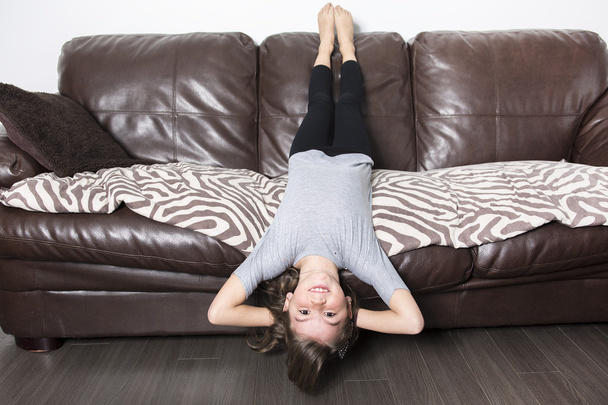 Young girl in a sofa - Фото, зображення