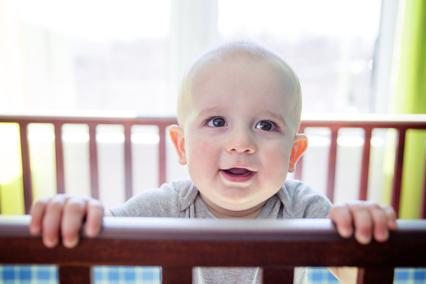 Adorable baby boy in his crib - Foto, Imagem