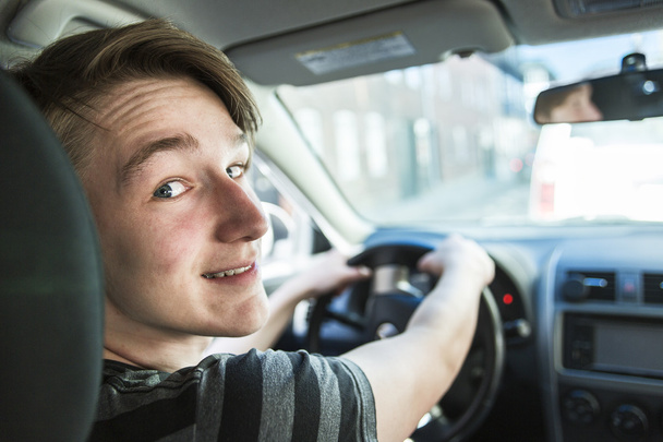 Teenage boy and new driver behind wheel of his car - Fotoğraf, Görsel