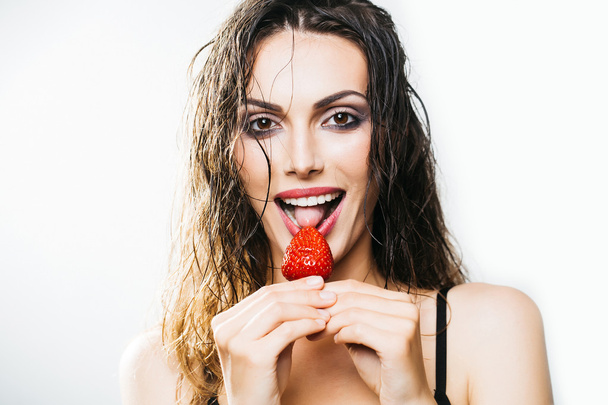 sexy pretty woman with red strawberry - Foto, afbeelding