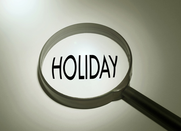 Magnifying glass with the word holiday - Zdjęcie, obraz