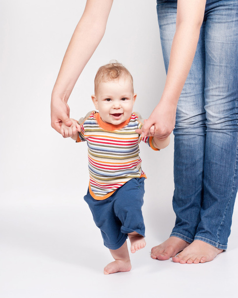 Baby taking first steps - 写真・画像