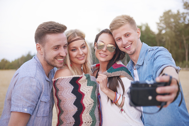 Friends taking selfie with a retro camera  - Фото, зображення