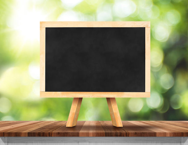 Blank blackboard on wood table   - Foto, Bild