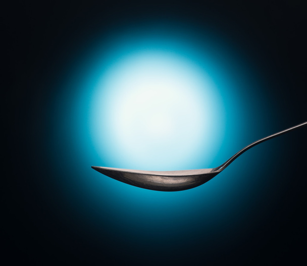 Vintage spoon with shiny background  - Foto, Imagen