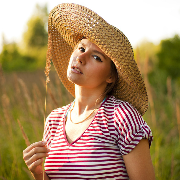 Portrait of a beautiful woman in a countryside - Photo, image