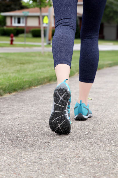 Runner/ woman  running on  a  road,  closeup on shoe/sneakers. 	 - Fotografie, Obrázek