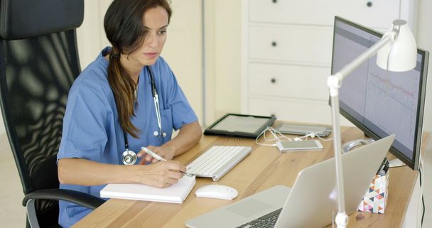 doctor working at desk in office - Photo, Image