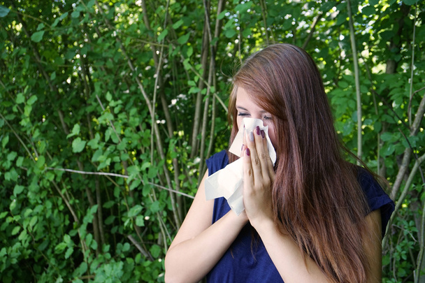 young woman blowing nose - Photo, Image