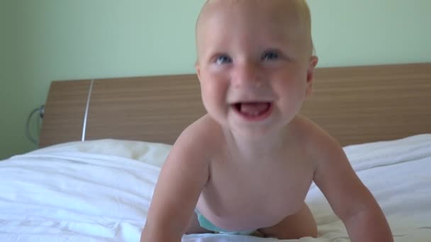 cute baby crawling on bed - Filmati, video