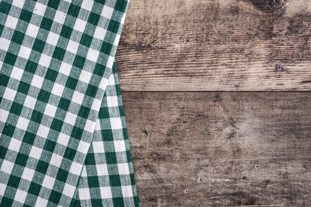Green tablecloth and rustic wood - Photo, Image