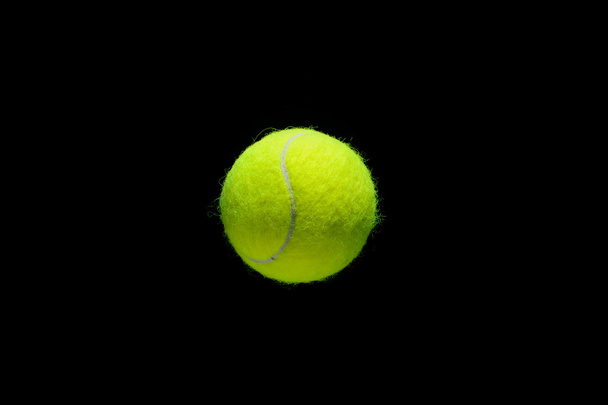 tennis ball over black background - Photo, Image