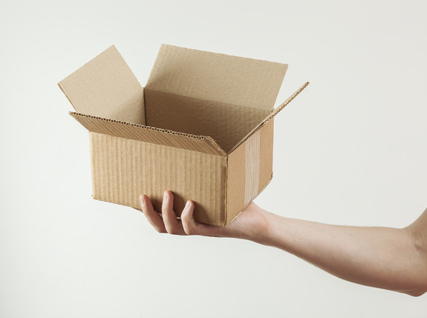 man's hand with paper empty box - Zdjęcie, obraz