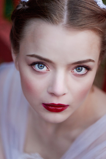 Close-up portrait of young girl with green eyes  a quality makeup. Boho style - 写真・画像